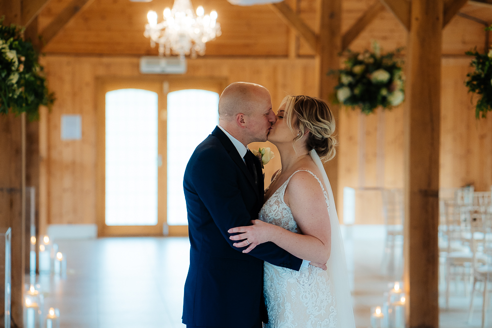 Bride and groom's first kiss at Merrydale Manor
