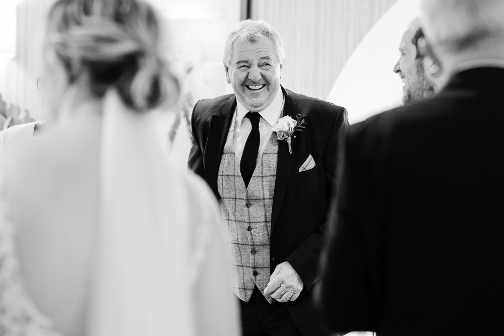 father of the bride laughing