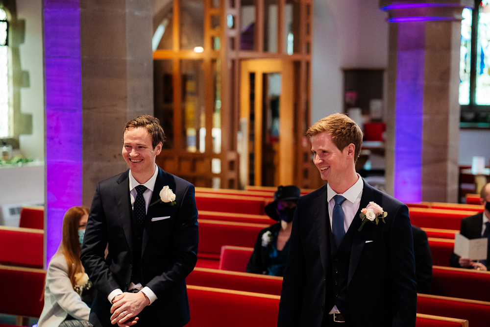 groom and best man at altar